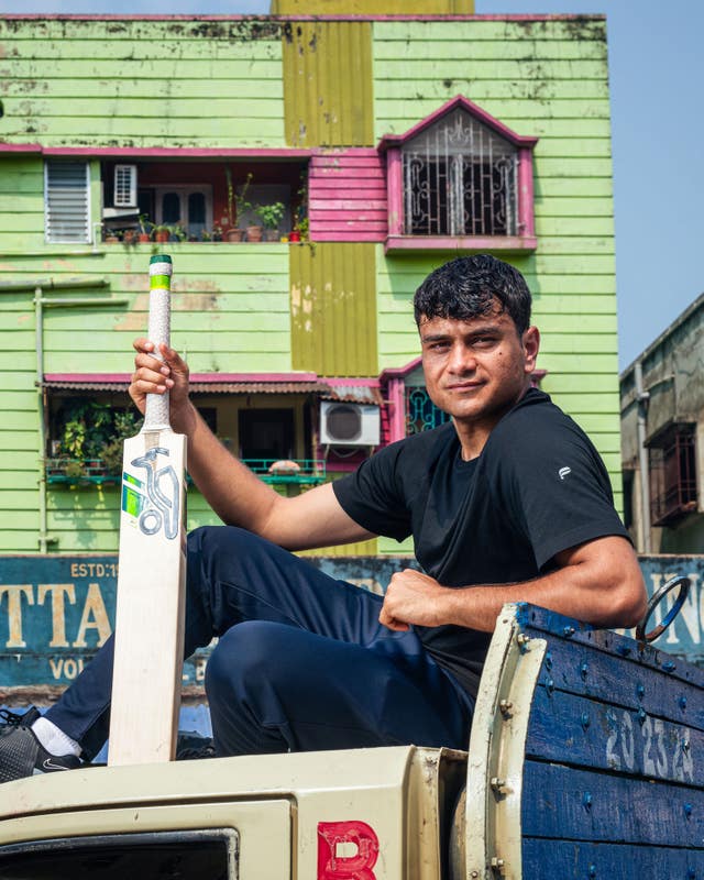 Adnan Miakhel holds a bat in a promotional shot from Field of Dreams.
