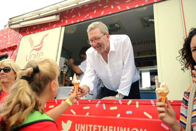 Unite's general secretary Len McCluskey serves ice cream to revellers