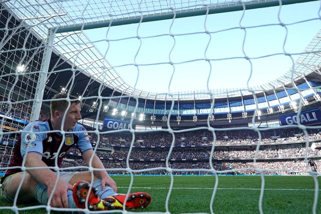 Matt Targett reacts after his own goal against Spurs