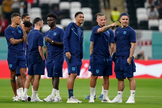 England players standing on a pitch during a training session