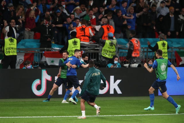 Italy's Jorginho celebrates scoring the winning penalty in the semi-final against Spain at Wembley
