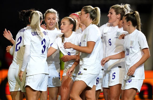 Leah Williamson (third left) celebrates scoring England's second goal 
