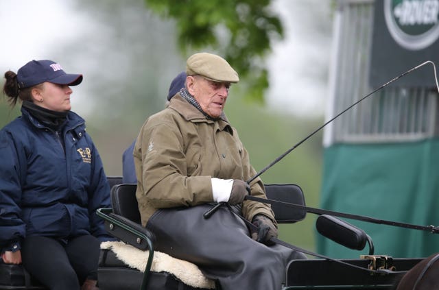 The Duke of Edinburgh drives a carriage (Andrew Matthews/PA)