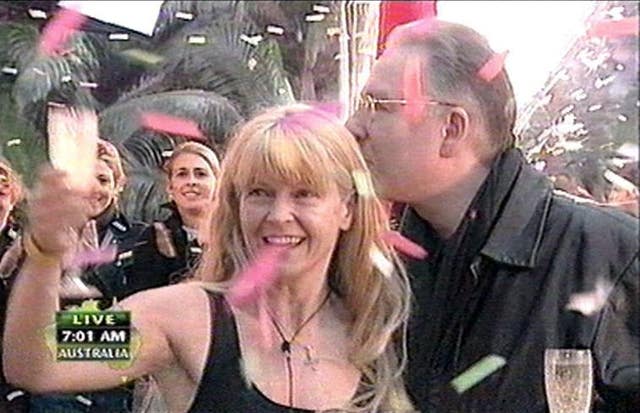 Toyah Willcox holding a glass, with her husband Robert Fripp