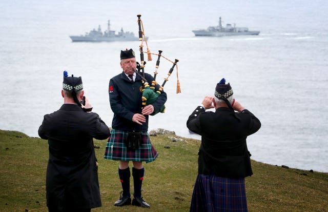 Pipe major Neil MacTaggart, from the Islay Community band, plays during the service (Jane Barlow/PA)
