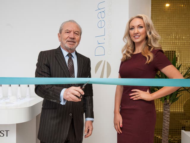 Dr Leah Totton and Lord Sugar cutting a blue ribbon