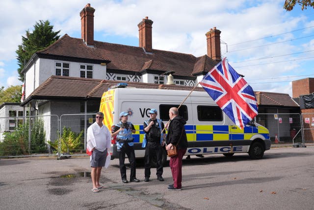Police officers and protesters outside the Bell Hotel after a temporary injunction that would have blocked asylum seekers from being housed at the hotel in Epping, Essex, on Friday 29 August was overturned at the Court of Appeal.