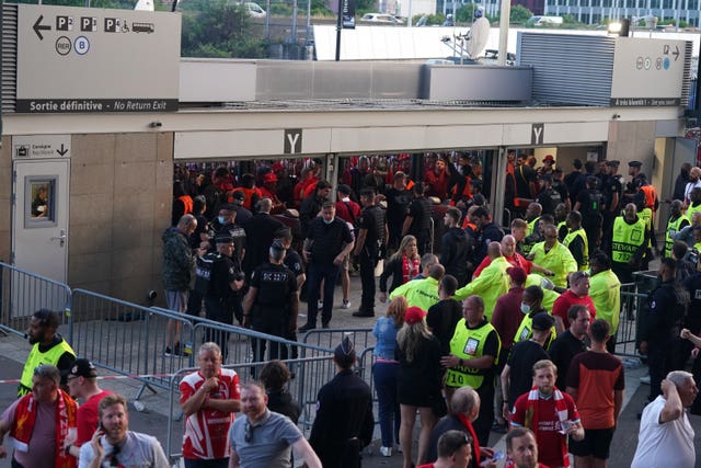 Fans wait in front of Gate Y of the Stade de France