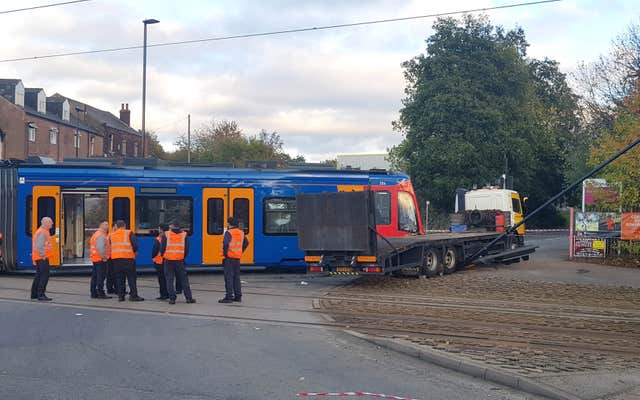 Emergency services at the scene in Staniforth Road Sheffield where a tram collided with a lorry on the Sheffield Supertram system