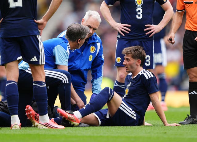 Billy Gilmour receives treatment for an injury 