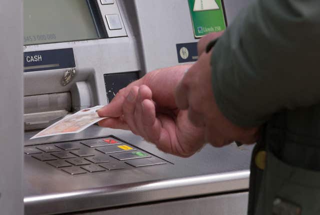 Money being withdrawn at ATM