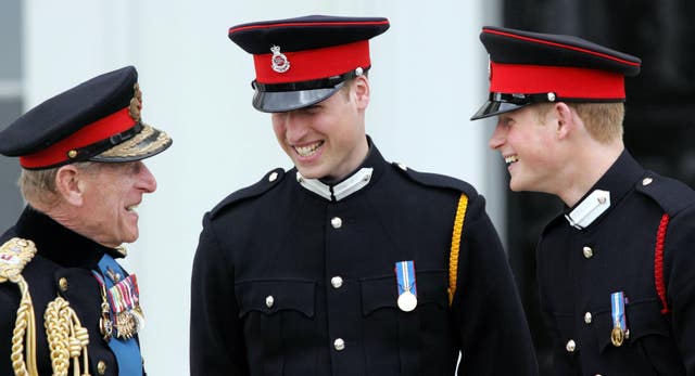 The Duke of Edinburgh speaks to Prince William and Prince Harry at Sandhurst