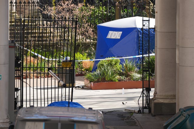 A police tent and the gates at King’s College London's Strand Campus