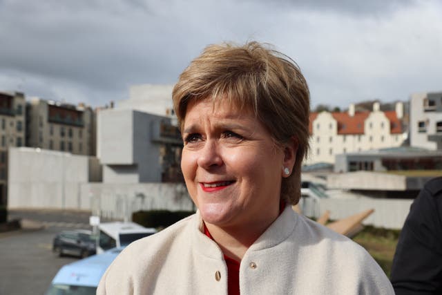 Headshot of Nicola Sturgeon smiling outside Holyrood