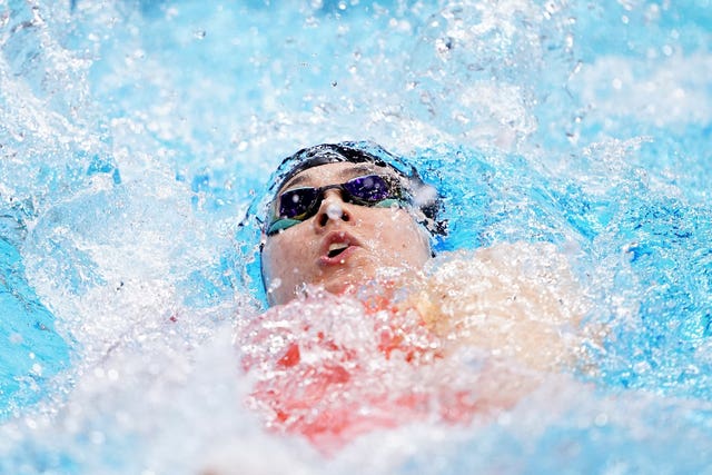 Alice Tai swims backstroke