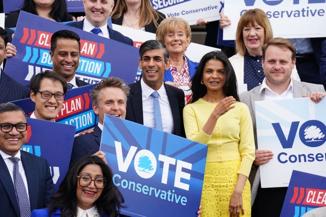 Rishi Sunak and his wife Akshata Murty surrounded by Tory activists