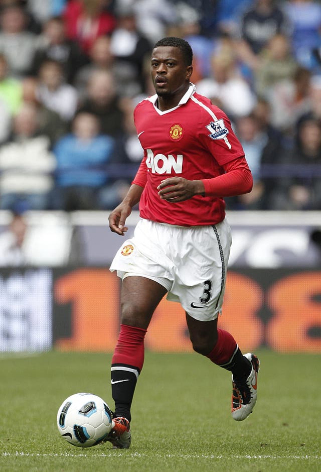 Patrice Evra running with the ball for Manchester United