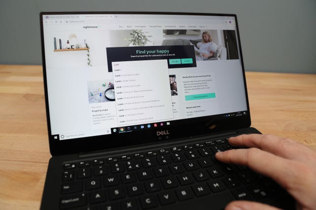 A person looks for properties for sale on the Rightmove website