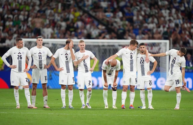 Slovenia players react in the penalty shoot-out defeat at Euro 2024
