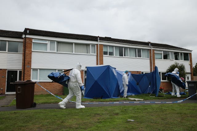 Forensic officers outside the house on Northdown Road in Solihull