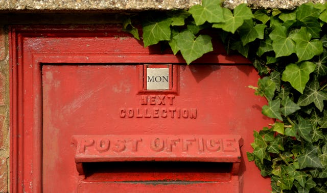 A Post Office post box  (Andrew Matthews/PA)