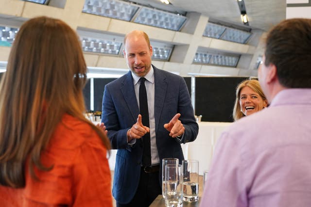 The Prince of Wales talks to participants at the Homewards event