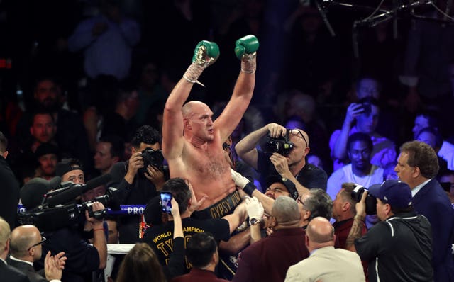 Fury, centre, is the WBC heavyweight champion (Bradley Collyer/PA)
