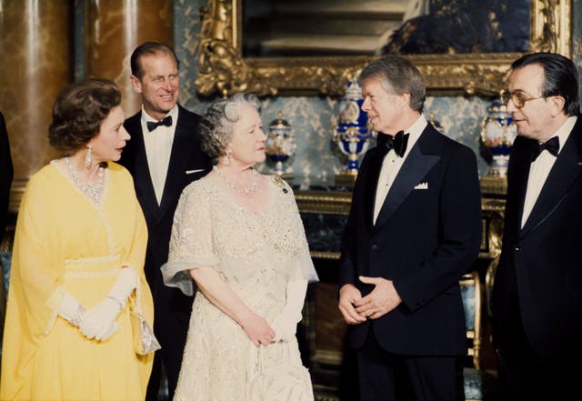 File photo dated 07/05/77 of (left to right) Queen Elizabeth II, the Duke of Edinburgh, Queen Elizabeth, the Queen Mother, US President Jimmy Carter and Italian Prime Minister Giulio Andreotti, in the Blue Drawing Room at Buckingham Palace, London. 