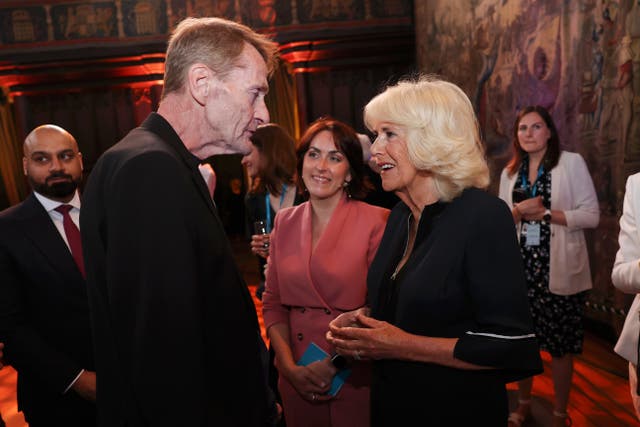 The Queen speaks with Lee Child in June 