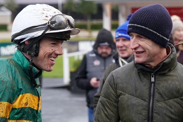 Brian Hayes and trainer Colm Murphy celebate after winning the Madigan Group Novice Chase with Impervious at Punchestown Racecourse