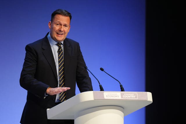 Russell Findlay speaking from a lectern