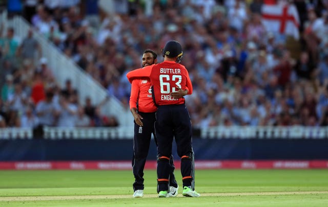 Adil Rashid and Jos Buttler celebrate the wicket of Australia’s Aaron Finch