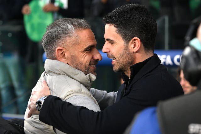 Arsenal manager Mikel Arteta (right) hugs Sporting Lisbon head coach Rui Borges