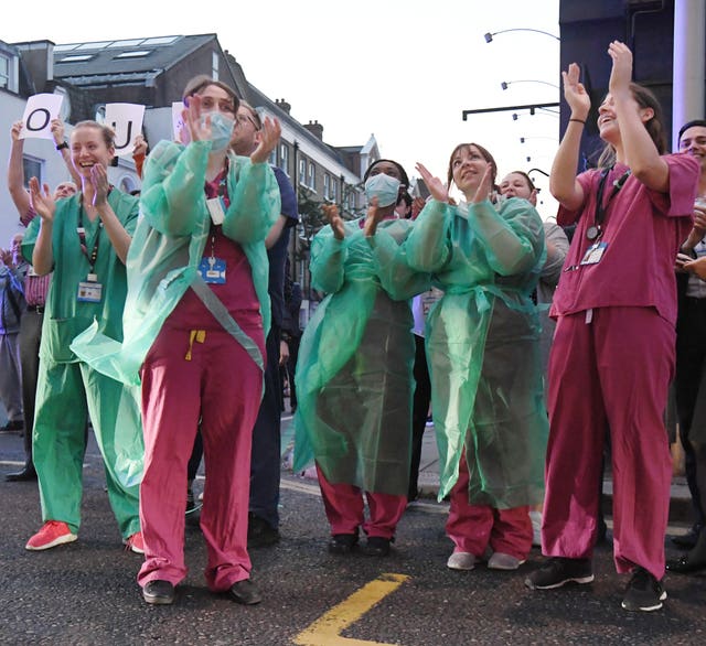 Staff from the Chelsea and Westminster Hospital in London respond to rousing applause 