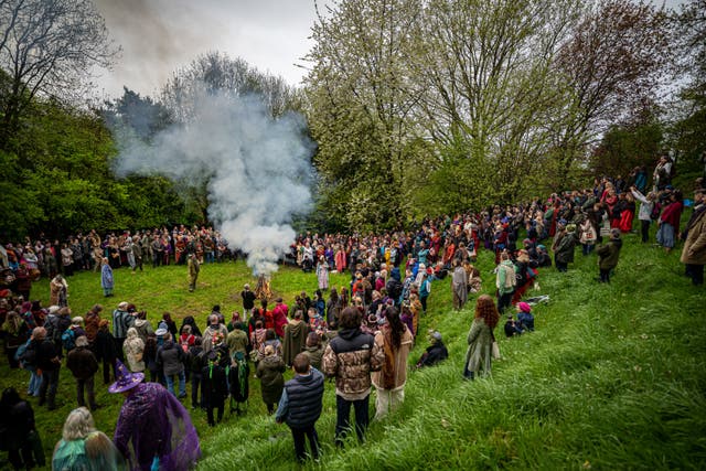 People watch the Beltane ceremony at Chalice Well