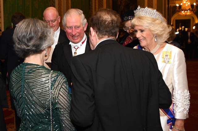 The Prince of Wales and the Duchess of Cornwall attend an evening reception for members of the Diplomatic Corps at Buckingham Palace