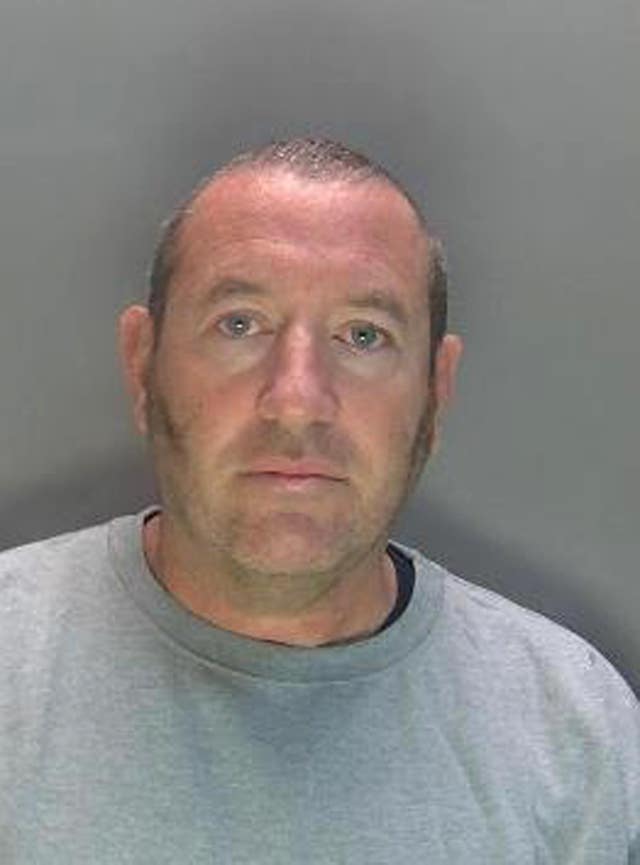 A police custody shot of David Carrick.