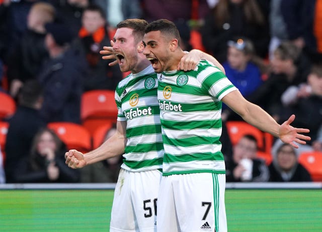Giakoumakis (right) scored the goal that clinched Celtic the title 
