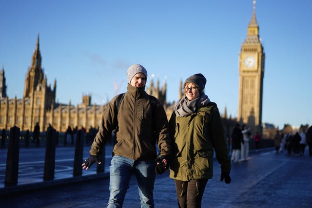 People wrapped up against the cold weather in Westminster