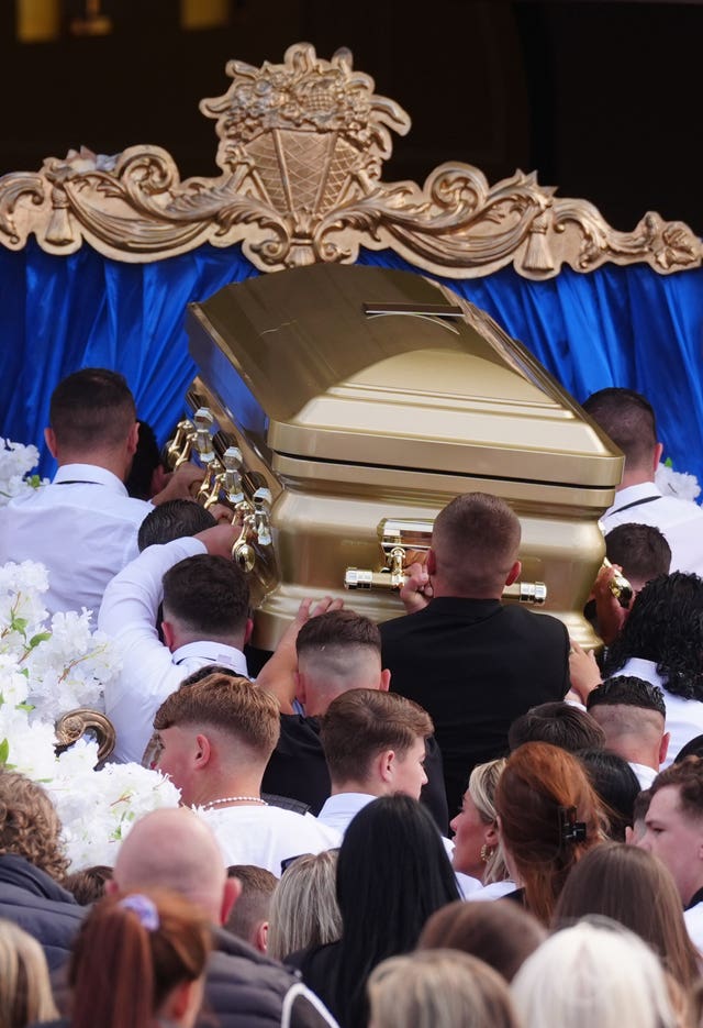 The coffin is carried into St Michael the Archangel Church in Athy for the funeral of Joe Carthy