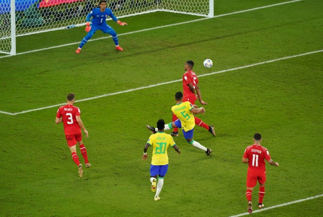Casemiro, centre, scores against Switzerland