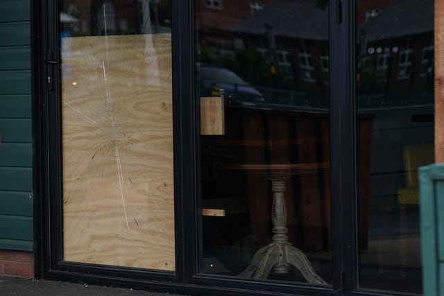 A damaged glass pub door