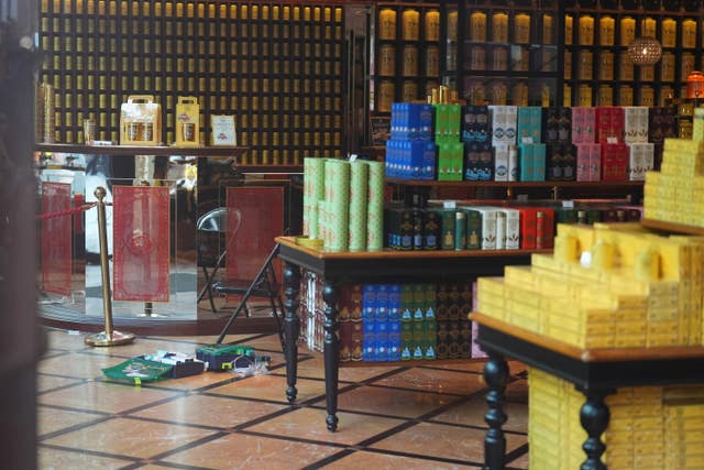 Discarded clothing and emergency medical equipment in the TWG Tea shop in Leicester Square 