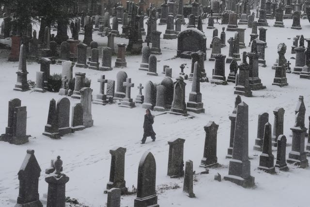 A person walks through the snow at the Church of the Holy Rude in Stirling 