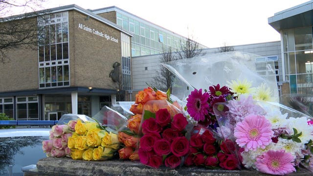 Floral tributes left outside All Saints Catholic High School in Sheffield 