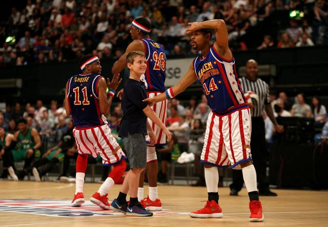 A spectator gets involved during The Original Harlem Globetrotters Tour.