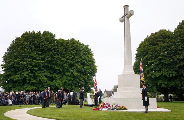 D-Day veteran Stan Ford (right) salutes after laying a wreath during the Royal British Legion Service of Remembrance in&nbsp; 2023