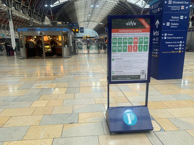 Signs at Paddington station in London warn of strike action
