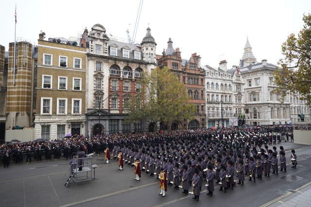 Members of the military form up on Parliament Street