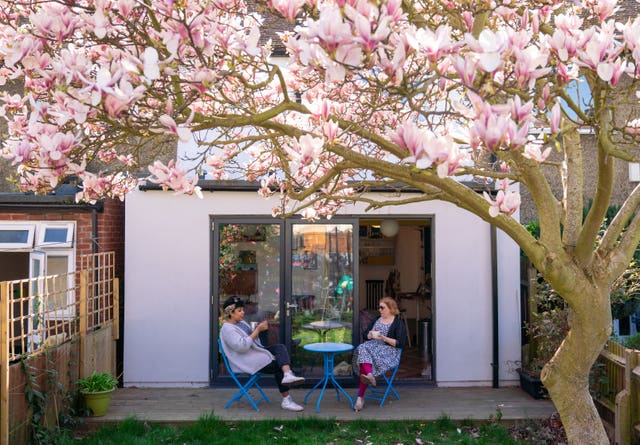 Nena Foster (left) visits her friend Helen Walters at home in Brockley, south east London